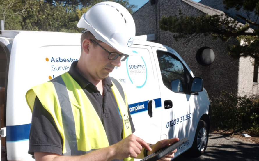 Asbestos consultant and mobile laboratory Asbestos consultant with tablet and van